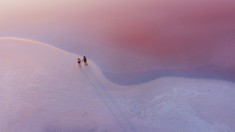 Photo of aerial view of couple walking